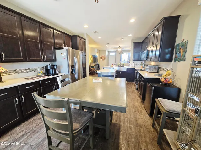 a view of a swimming pool with a table and chairs