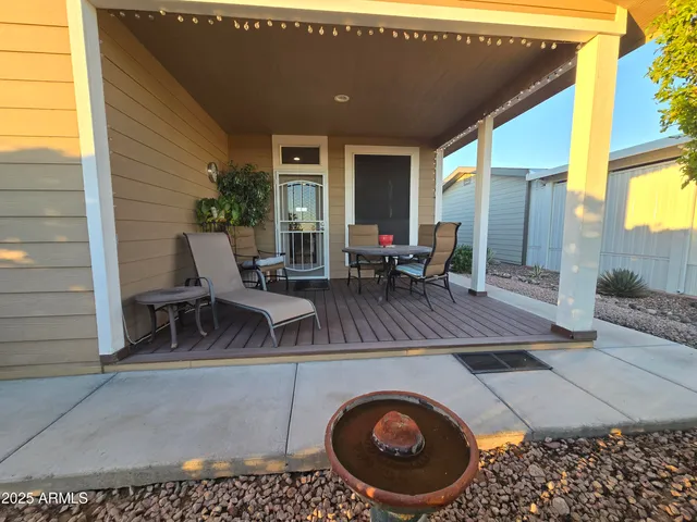 a view of a patio with wooden floor