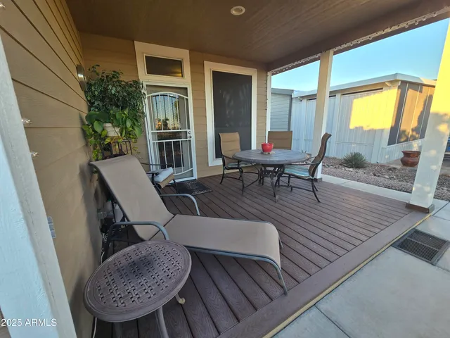 a view of two chairs in the balcony