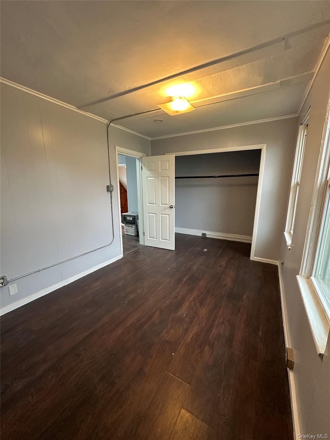 39 Spruce Street Poughkeepsie, NY 12601 - Photo 7 of 11 a view of empty room with wooden floor and fireplace