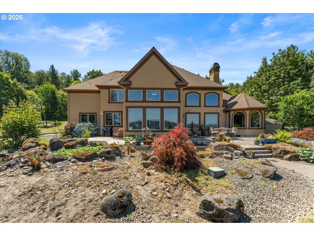37123 Northeast Reed Road Corbett, OR 97019 - Photo 46 of 48 a front view of a house with garden