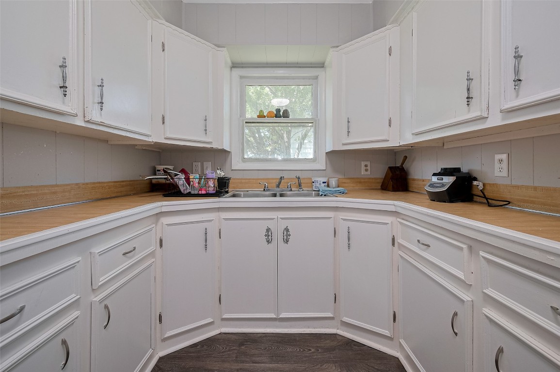 16128 1/2 Ridlon Street Channelview, TX 77530 - Photo 15 of 43 U-shaped and efficient, the kitchen delivers abundant counter space and cabinetry, with a layout that keeps everything within reach—ideal for both quick bites and culinary experimentation.