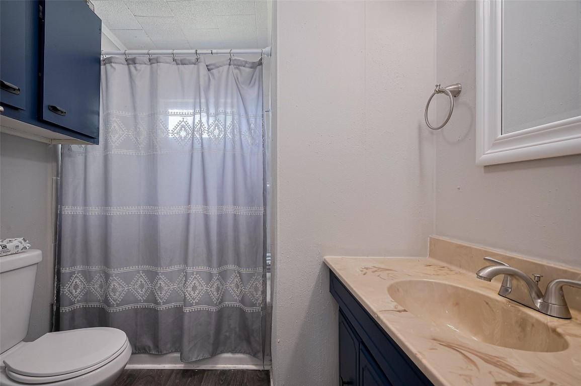 16128 1/2 Ridlon Street Channelview, TX 77530 - Photo 16 of 43 A full bathroom with a vanity adds functionality and convenience in a modest footprint.