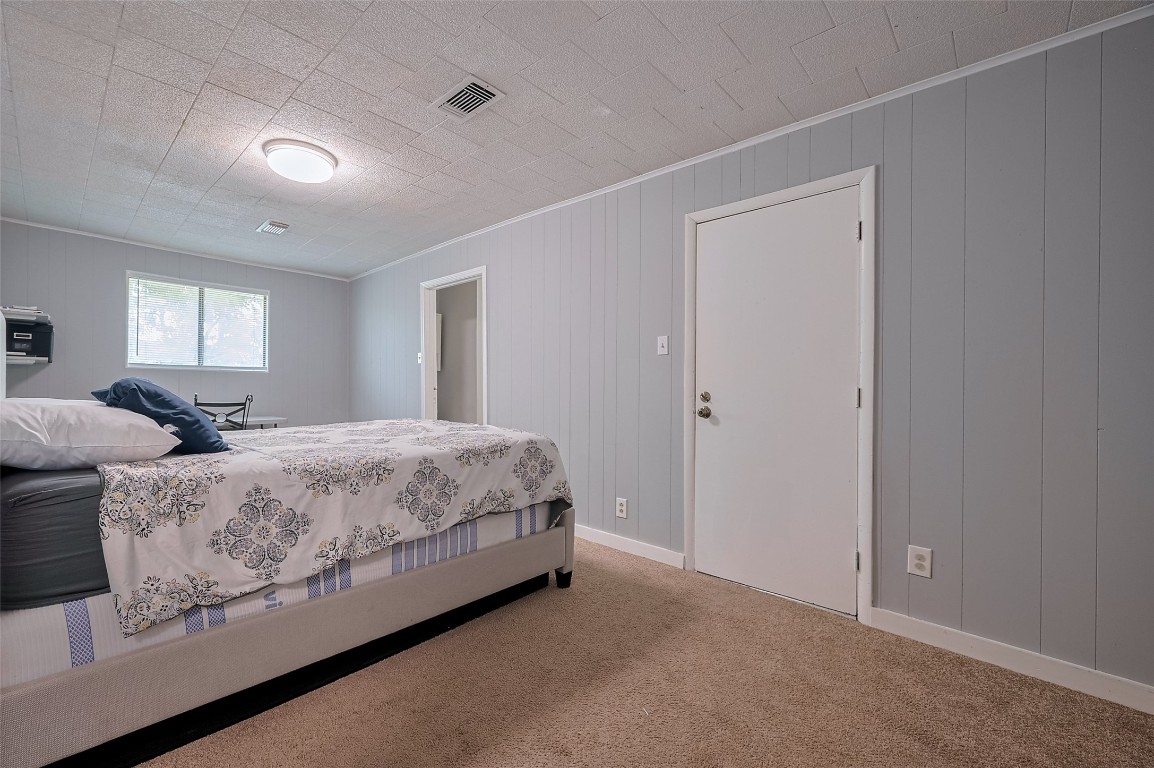 16128 1/2 Ridlon Street Channelview, TX 77530 - Photo 22 of 43 Another well-sized bedroom with plush carpeting awaits. Ample space for a desk or hobby corner makes this a flexible, multi-use room.