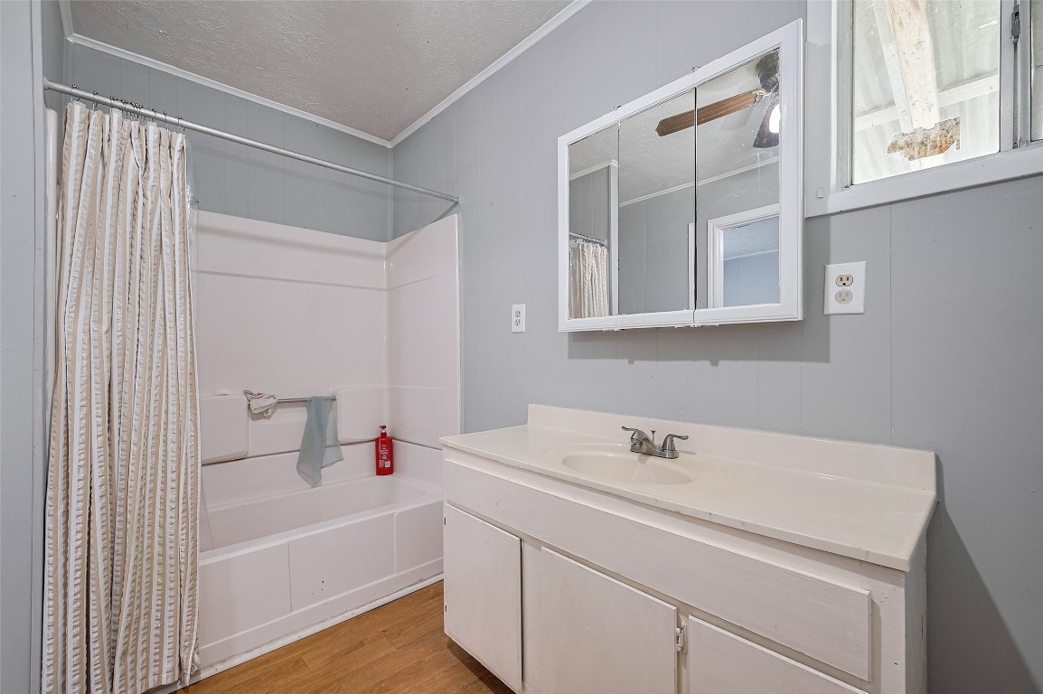 16128 1/2 Ridlon Street Channelview, TX 77530 - Photo 24 of 43 A second full bathroom includes a tub-shower combo and a well-proportioned vanity, completing the main house with thoughtful utility.