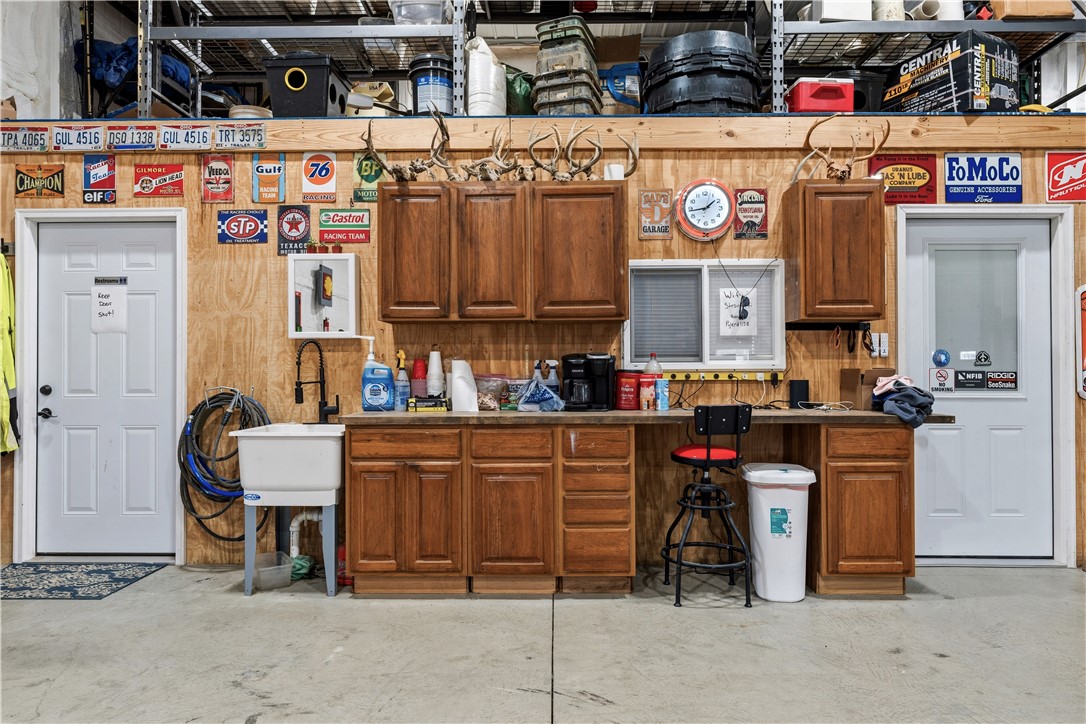 1158 Pyle Road Clarksville, OH 45113 - Photo 63 of 76 This versatile garage space offers ample storage and a dedicated workspace for various projects.