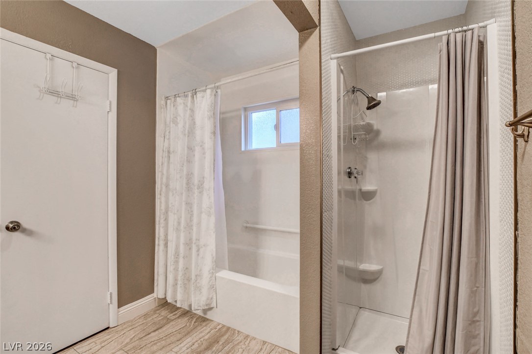 4367 South Mojave Road Las Vegas, NV 89121 - Photo 30 of 53 Functional bathing solutions, including a shower stall and a bathtub with an overhead shower, meet everyday needs.