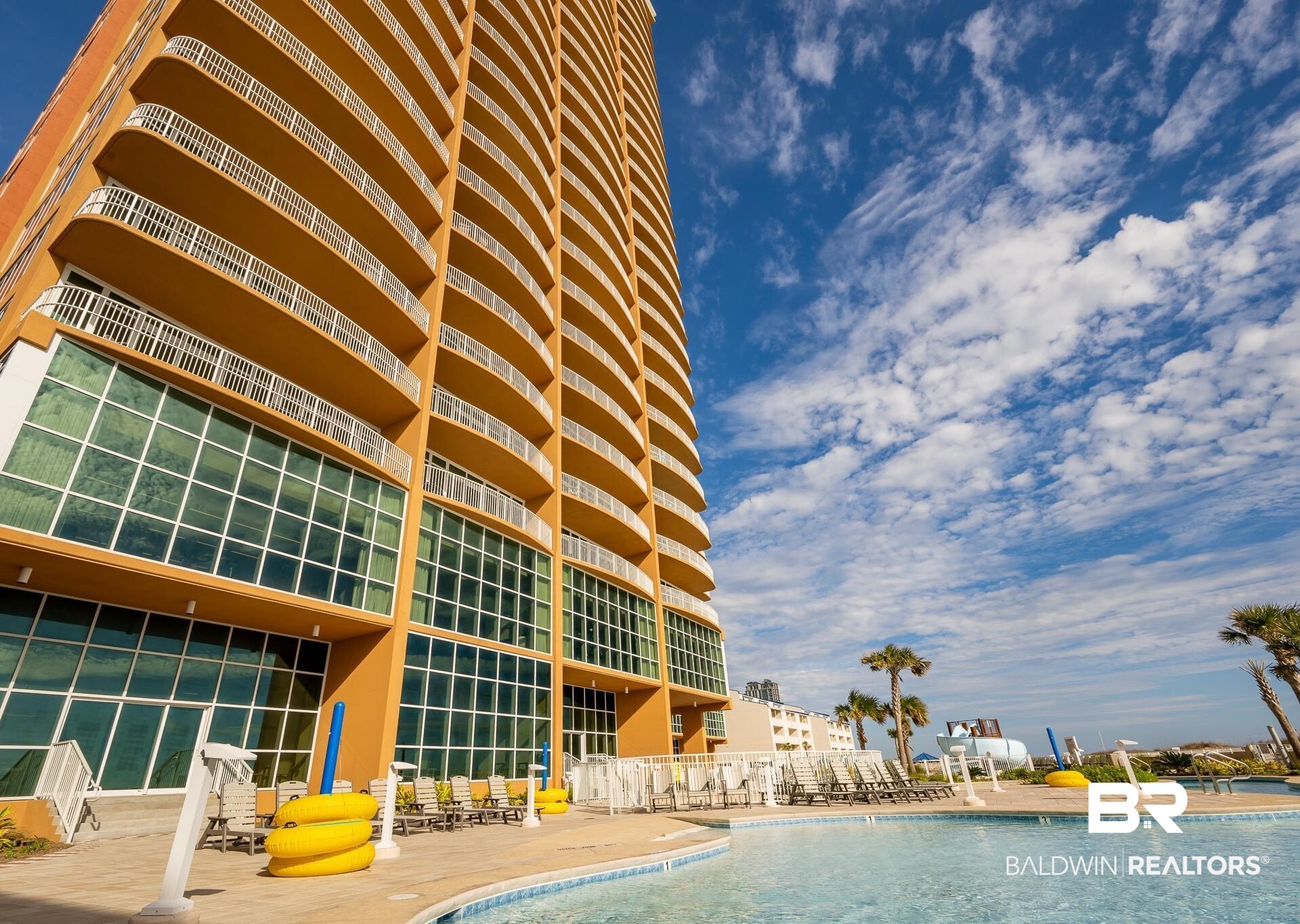 23008 Perdido Beach Boulevard, Unit 506 Orange Beach, AL 36561 - Photo 31 of 48 Community pool with a patio