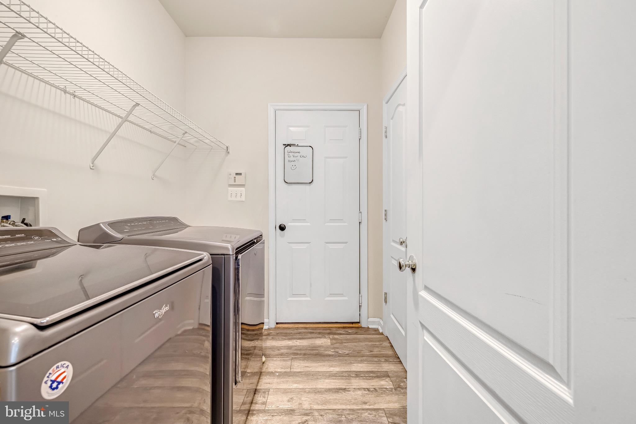 12 Evan Court Brunswick, MD 21758 - Photo 19 of 39 a utility room with dryer and washer