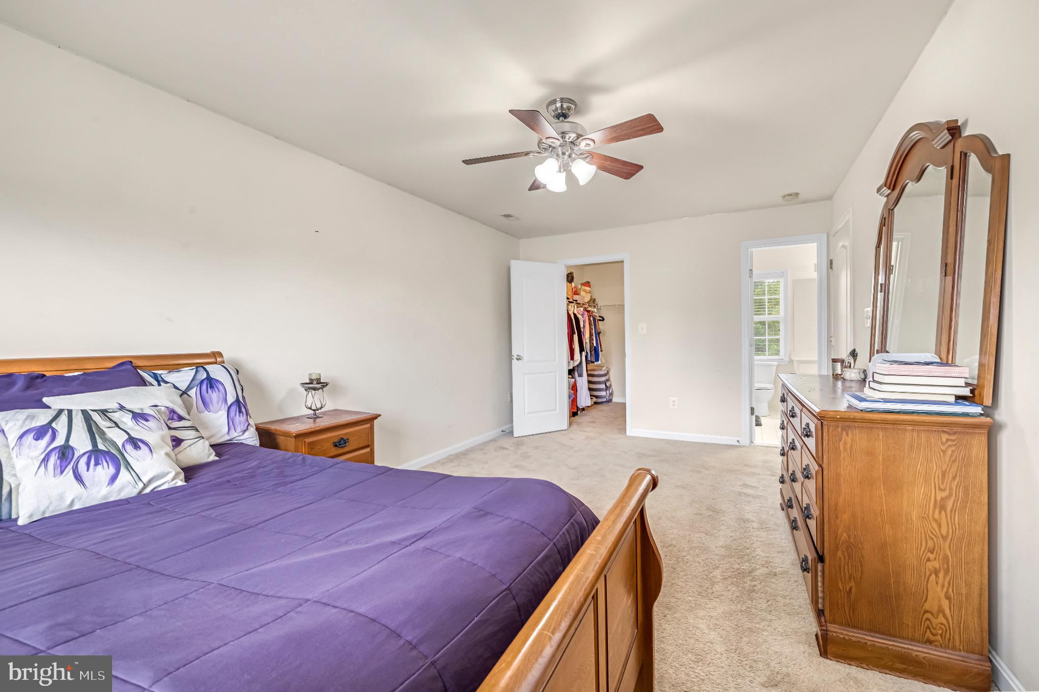 12 Evan Court Brunswick, MD 21758 - Photo 22 of 39 a bedroom with a bed and a chandelier