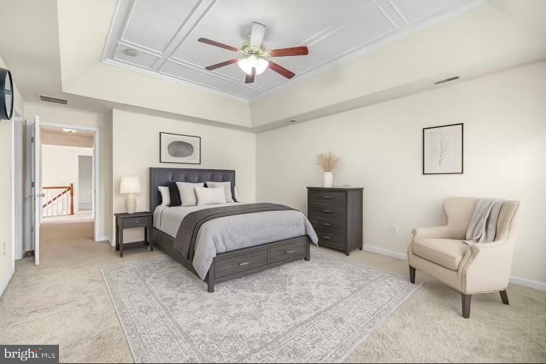 12 Evan Court Brunswick, MD 21758 - Photo 31 of 39 a bedroom with a large bed a couch and a chandelier