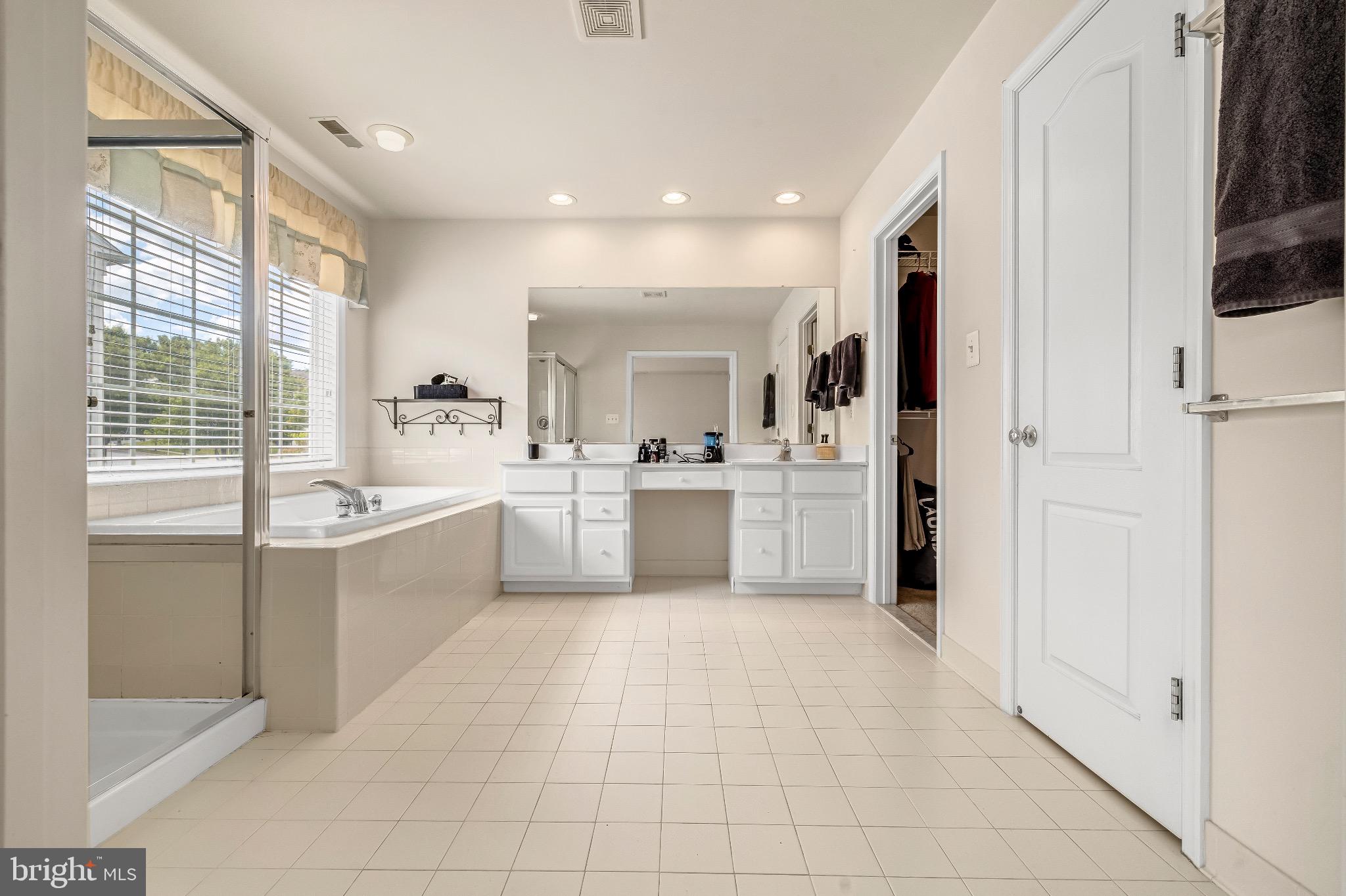 12 Evan Court Brunswick, MD 21758 - Photo 34 of 39 a large white kitchen with a sink a window and stainless steel appliances