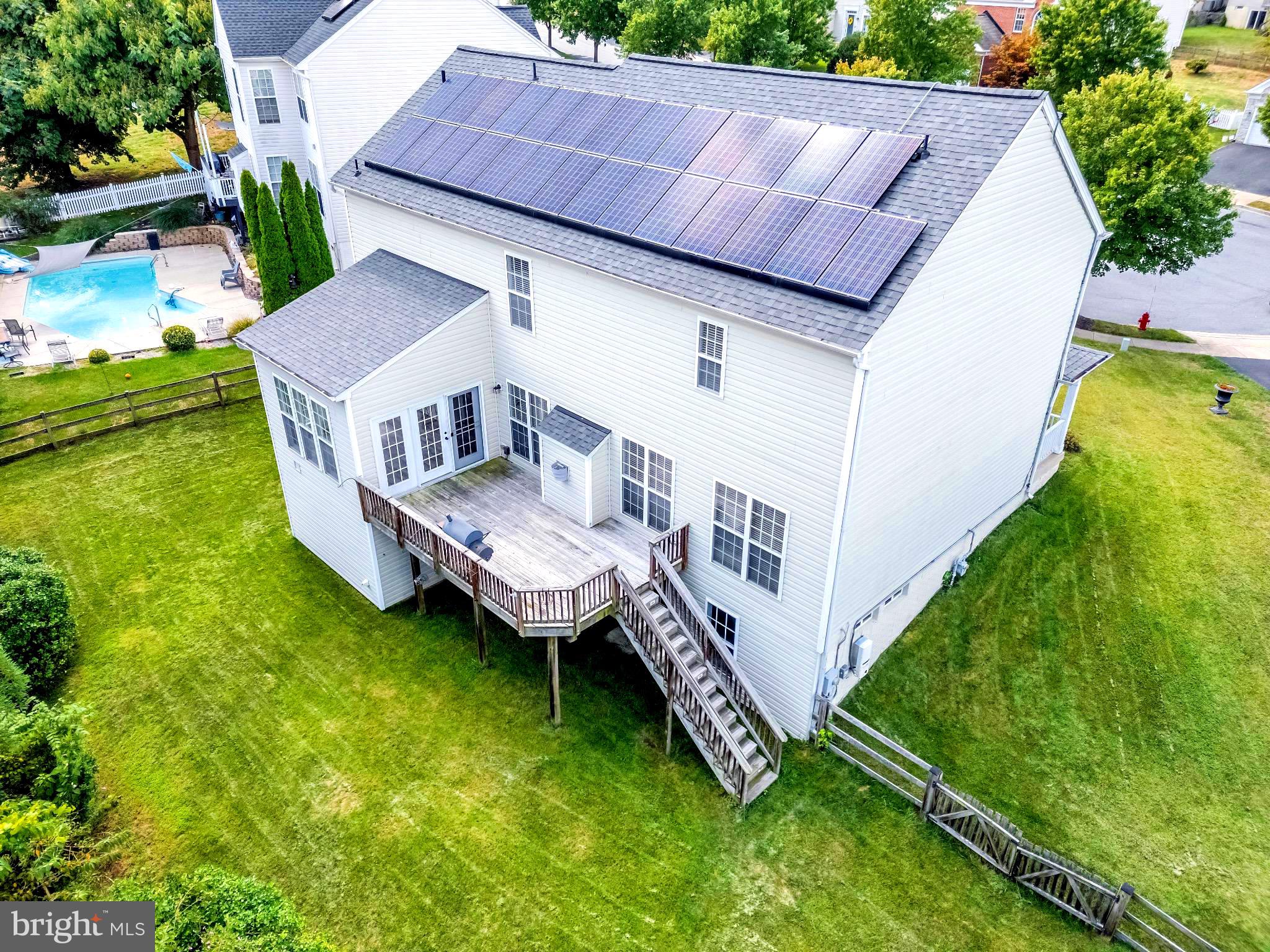 12 Evan Court Brunswick, MD 21758 - Photo 36 of 39 a view of a backyard with a small deck and a garden