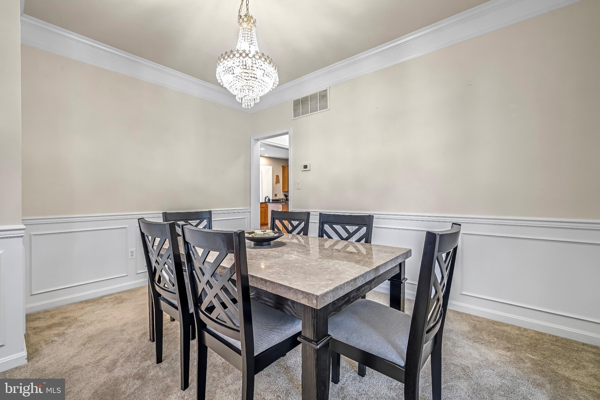 12 Evan Court Brunswick, MD 21758 - Photo 7 of 39 a view of a dining room with furniture and chandelier