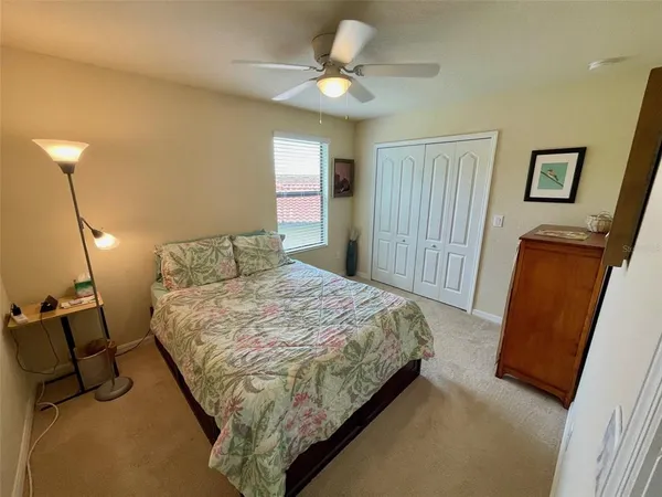 a bedroom with bed and a window