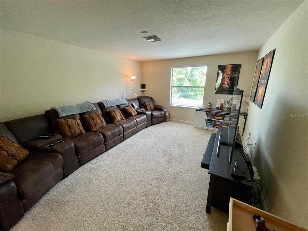 20940 Valore Court Venice, FL 34293 - Photo 24 of 52 a living room with furniture and a window