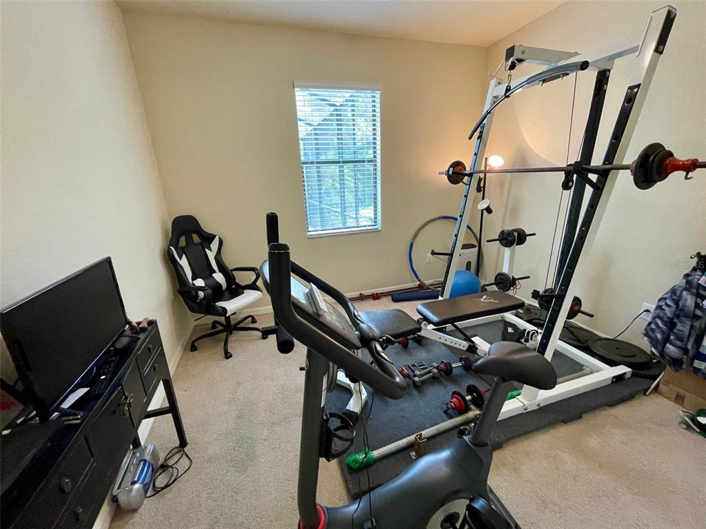 20940 Valore Court Venice, FL 34293 - Photo 28 of 52 a room with gym equipment and windows