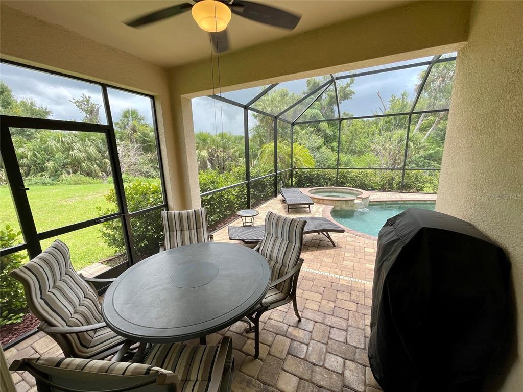 20940 Valore Court Venice, FL 34293 - Photo 29 of 52 a view of a dining room with furniture window and outside view