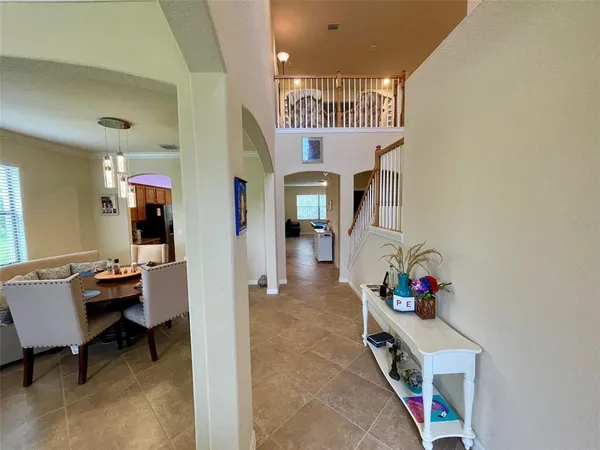 a view of a livingroom with furniture and an entryway