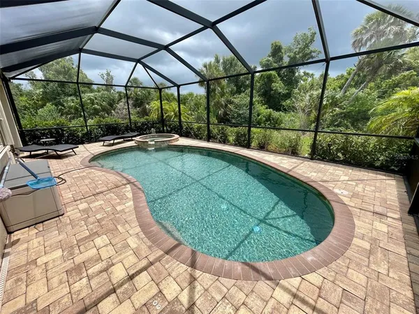 a view of a swimming pool with a yard