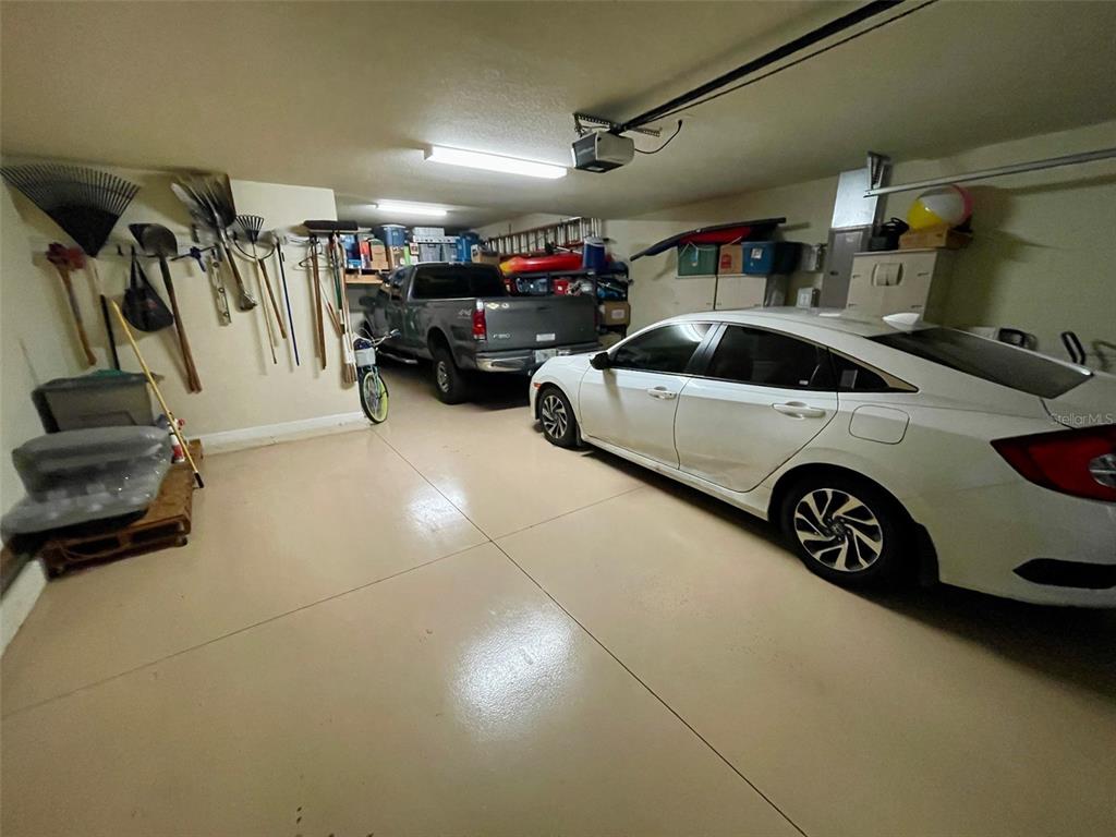 20940 Valore Court Venice, FL 34293 - Photo 37 of 52 a view of parking garage with cars and other equipment