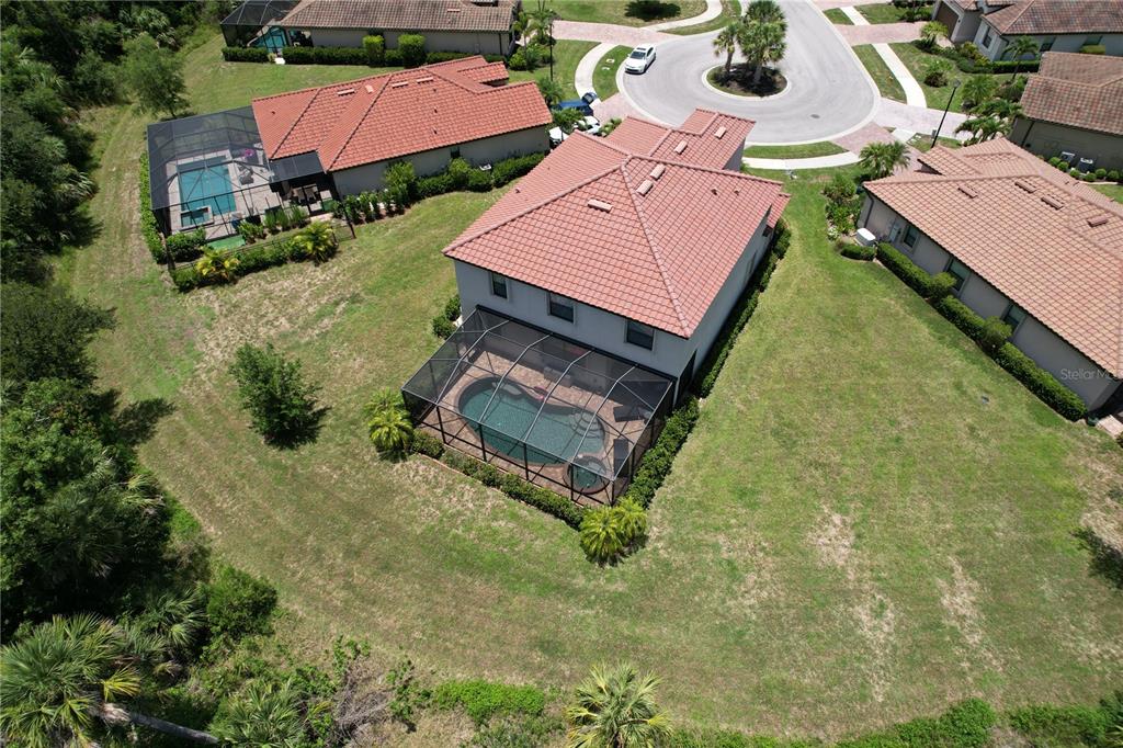 20940 Valore Court Venice, FL 34293 - Photo 39 of 52 an aerial view of a house with a yard