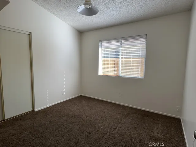 an empty room with a empty space and windows