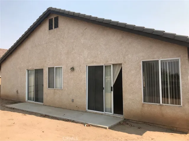 a view of a back yard of the house