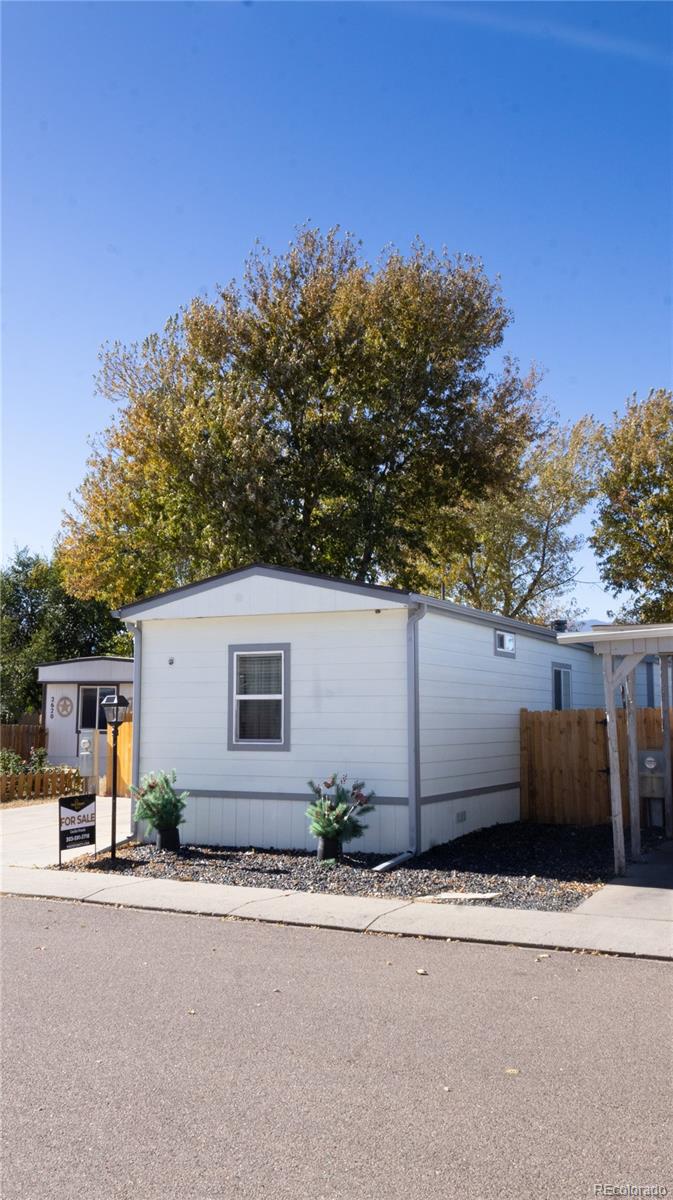 2612 Swale Run Colorado Springs, CO 80916 - Photo 1 of 25 front view of a house with a street