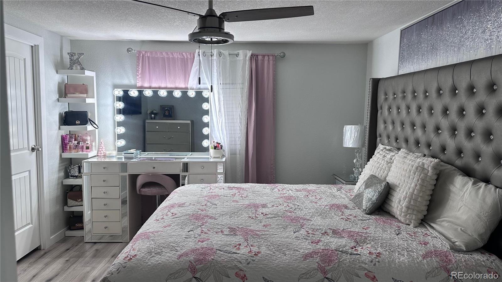 2612 Swale Run Colorado Springs, CO 80916 - Photo 12 of 25 a bed room with a bed and a television