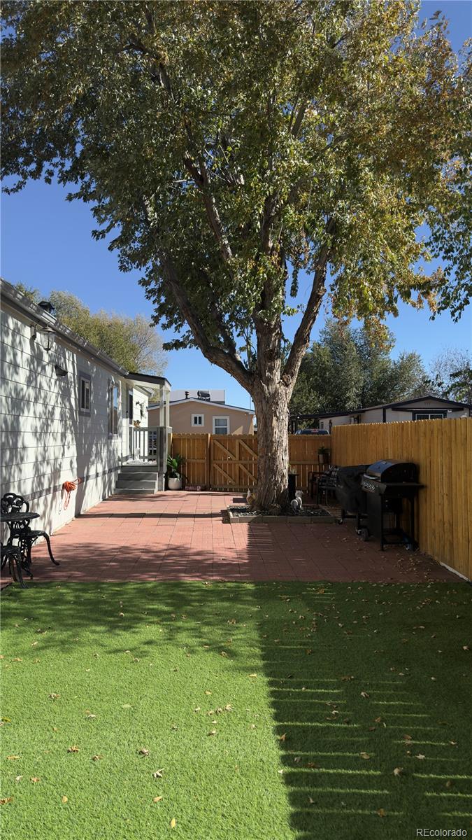 2612 Swale Run Colorado Springs, CO 80916 - Photo 2 of 25 a view of a house with a big yard