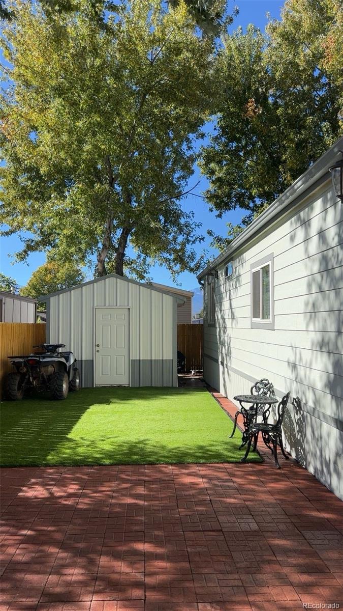 2612 Swale Run Colorado Springs, CO 80916 - Photo 3 of 25 a view of a backyard with a house