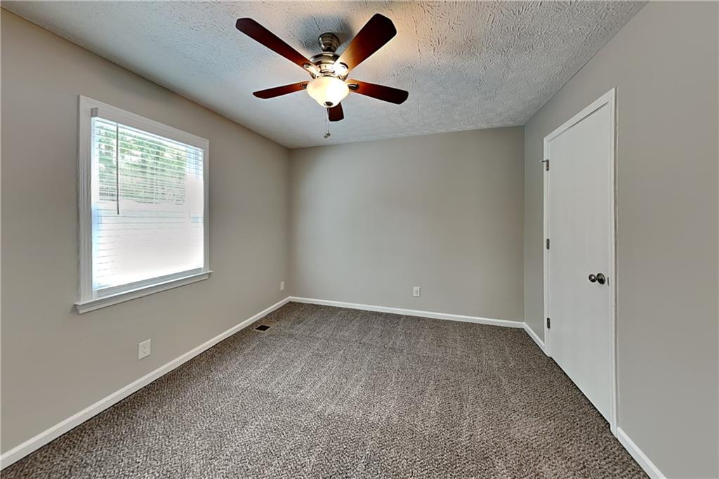 10610 Colony Glen Drive Alpharetta, GA 30022 - Photo 15 of 22 an empty room with a window