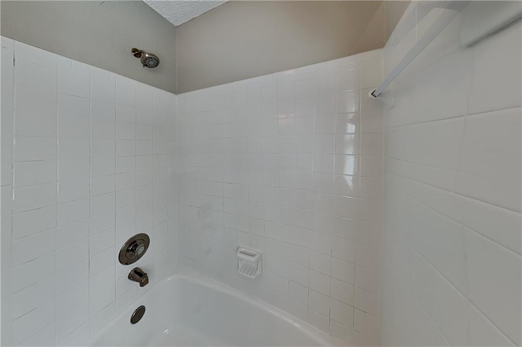 10610 Colony Glen Drive Alpharetta, GA 30022 - Photo 19 of 22 a bathroom with a tub