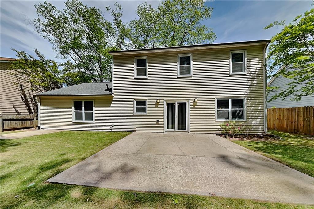 10610 Colony Glen Drive Alpharetta, GA 30022 - Photo 20 of 22 a front view of a house with a yard