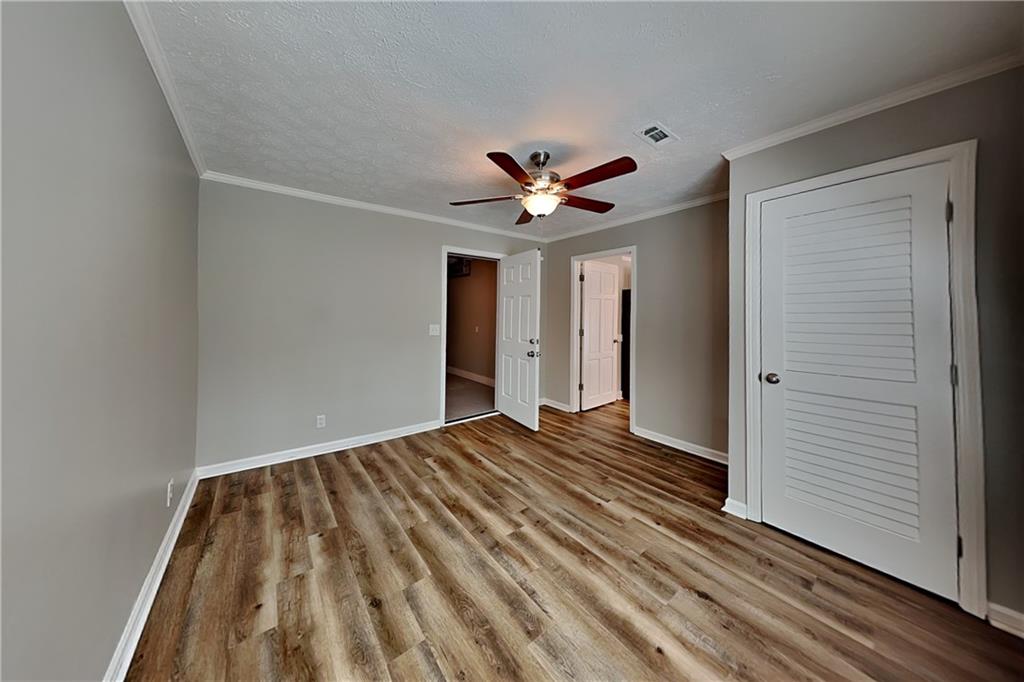 10610 Colony Glen Drive Alpharetta, GA 30022 - Photo 6 of 22 a view of empty room with wooden floor