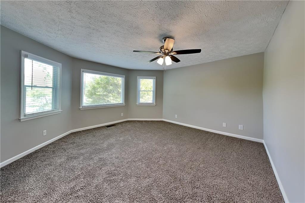 10610 Colony Glen Drive Alpharetta, GA 30022 - Photo 10 of 22 a view of an empty room with a window