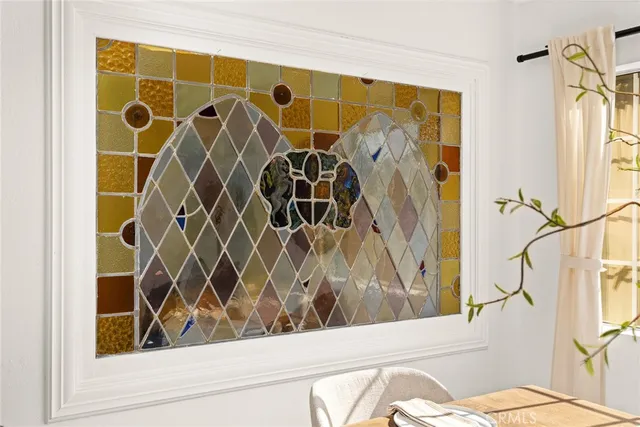 a bathroom with a shower curtain and a window