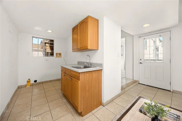 a room with a sink and a window