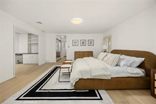 a bedroom with a bed and a couch