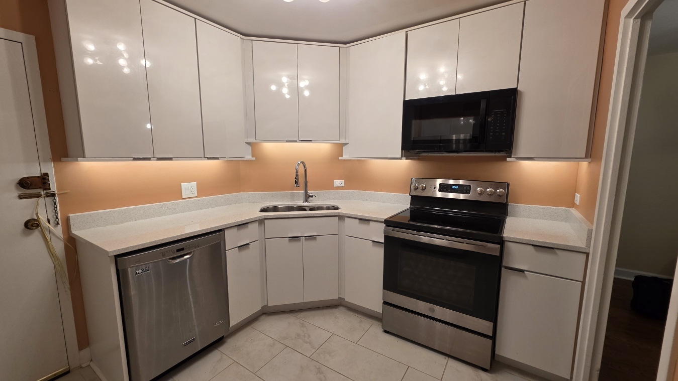 6033 North Sheridan Road, Unit 5G Chicago, IL 60660 - Photo 8 of 24 a kitchen with a sink and a stove top oven
