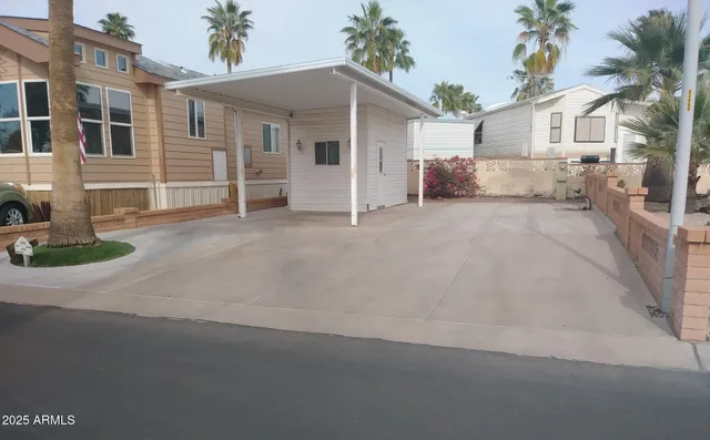a view of a house with a yard and garage