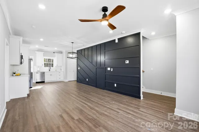 a view of an empty room with a cabinet