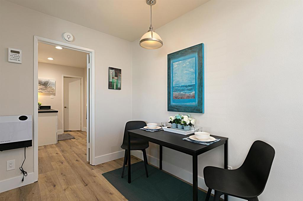 1202 North Pacific Street, Unit 106B Oceanside, CA 92054 - Photo 12 of 18 a dining room with furniture and window