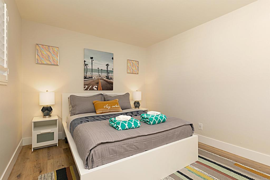 1202 North Pacific Street, Unit 106B Oceanside, CA 92054 - Photo 14 of 18 a living room with furniture and a table