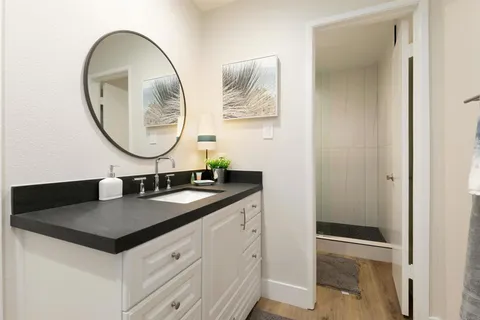 a bathroom with a sink and a mirror