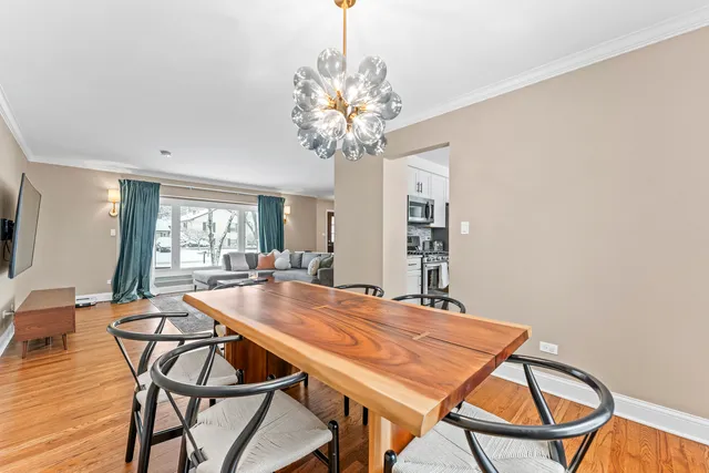 a dining room with furniture and window