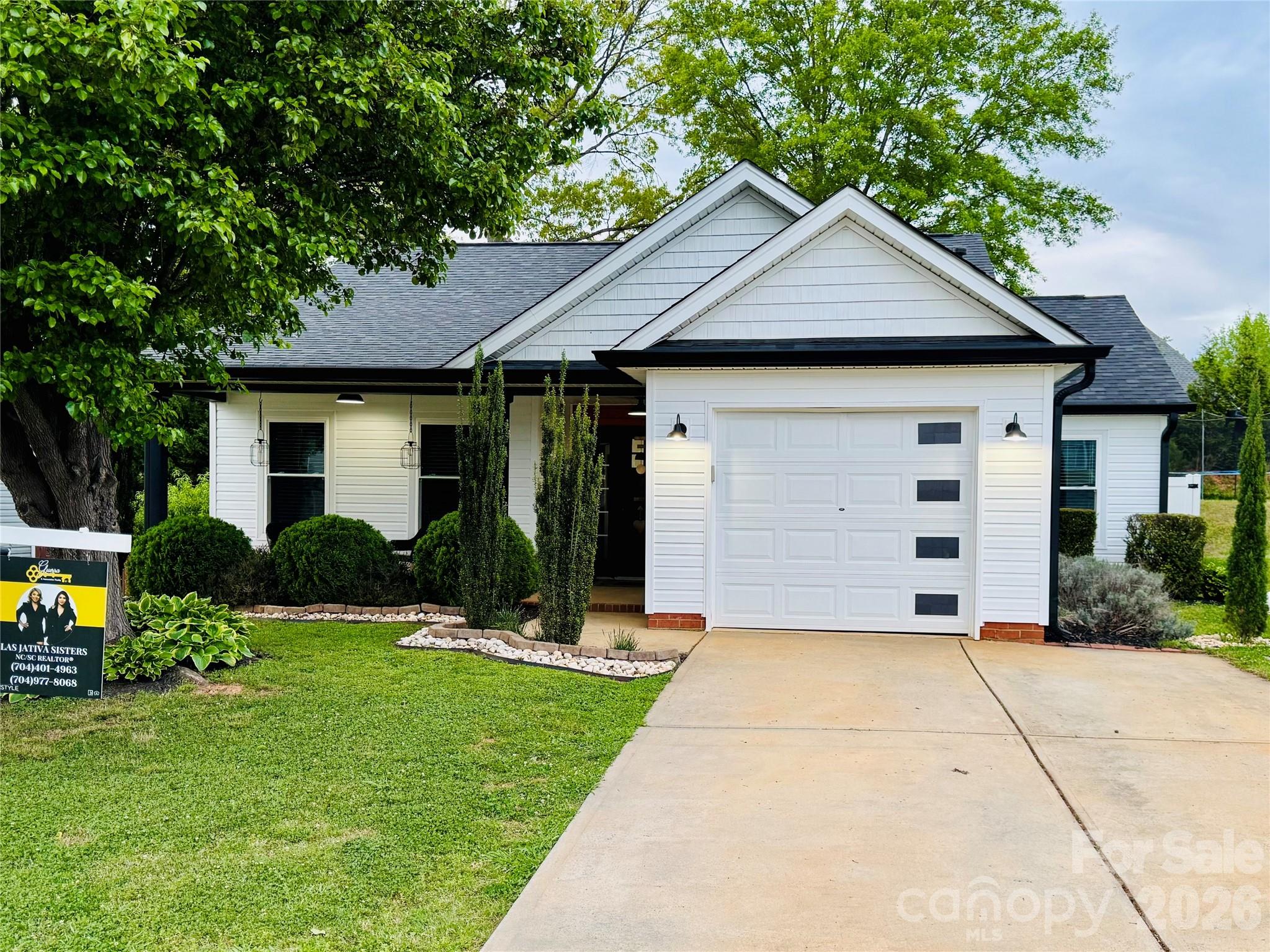 3056 Brookchase Boulevard Fort Mill, SC 29707 - Photo 1 of 23 a front view of a house with a yard and potted plants