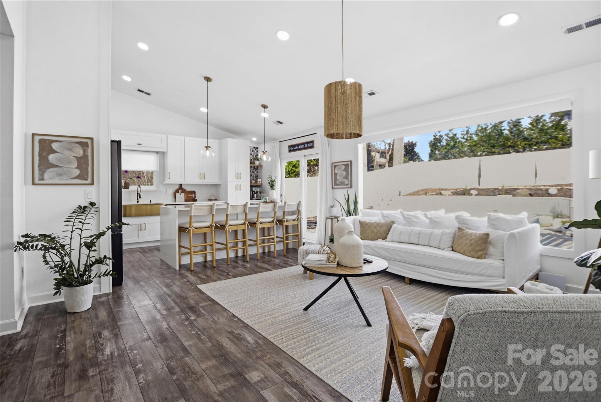 3056 Brookchase Boulevard Fort Mill, SC 29707 - Photo 3 of 23 a living room with furniture kitchen view and a wooden floor