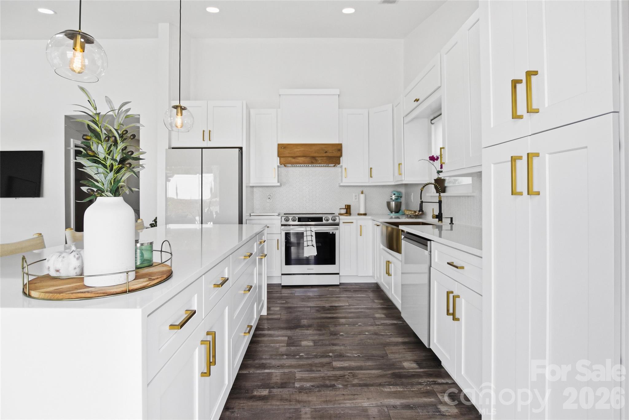 3056 Brookchase Boulevard Fort Mill, SC 29707 - Photo 6 of 23 a kitchen with kitchen island granite countertop lots of counter space and stainless steel appliances